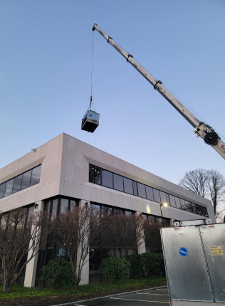 Crane Installing HVAC Roof Unit